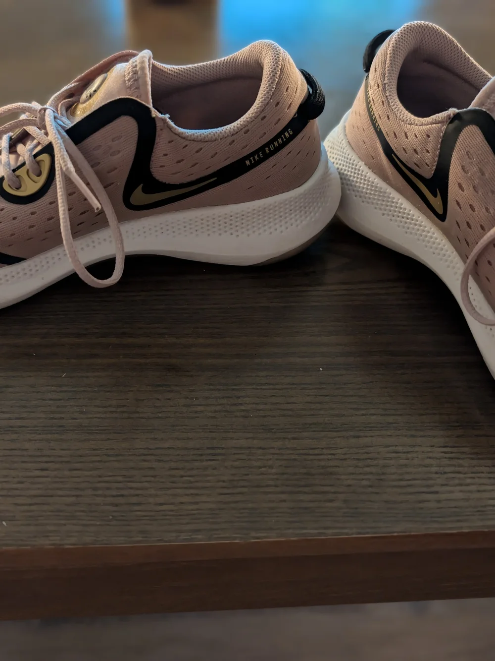 Nike Women's Blush Pink Athletic Sneakers with Black Swoosh